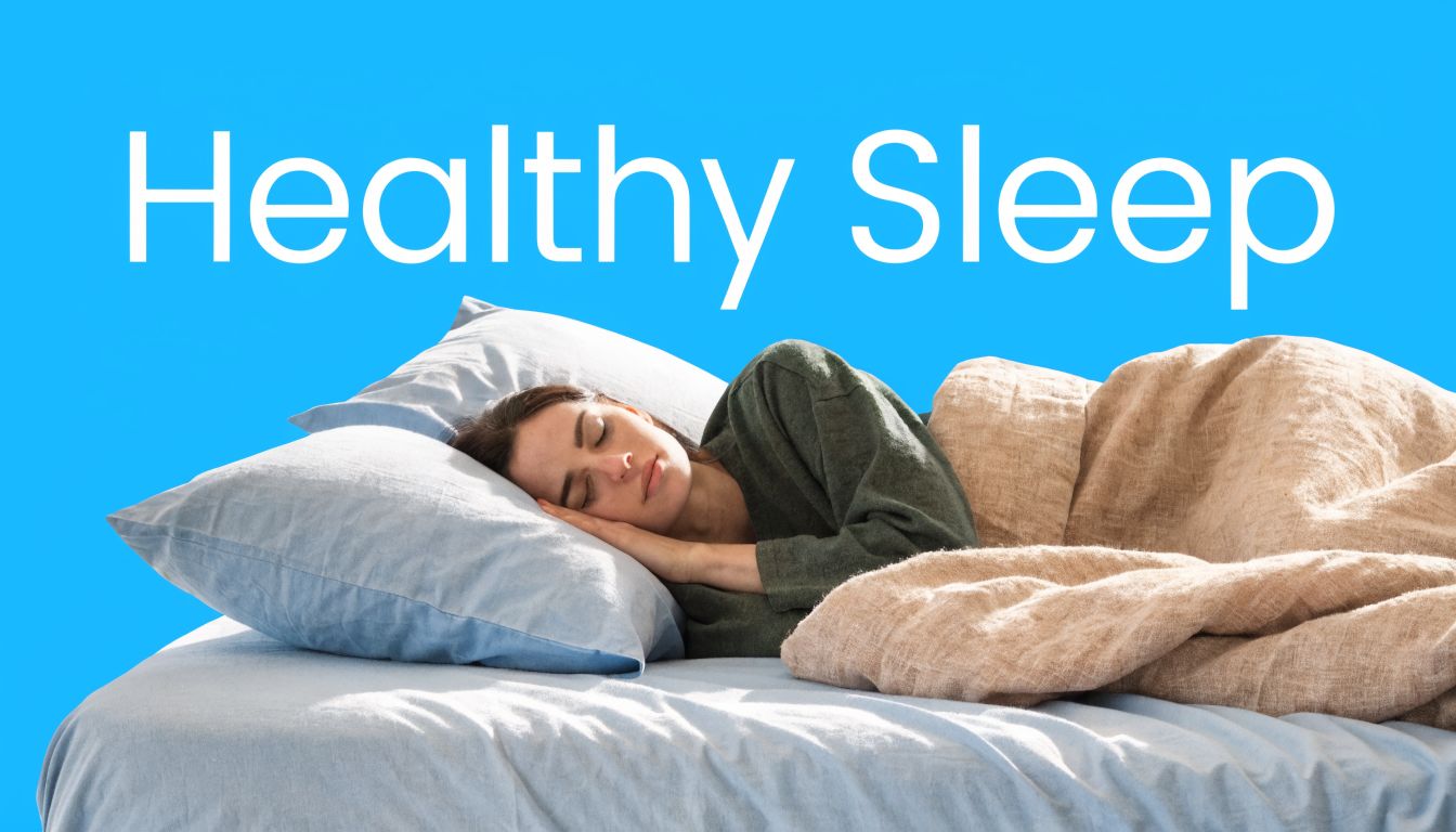 A woman sleeping comfortably in a bed under soft blankets against a bright blue background.